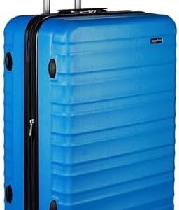 Amazon Basics Hard Shell Large Suitcase - Expandable ABS Travel Luggage with 4 Double Spinner Wheels - Scratch Resistant and Lightweight Construction - 78 x 52.6 x 32cm - Light Blue
