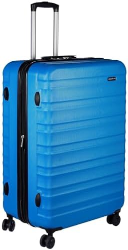 Amazon Basics Hard Shell Large Suitcase - Expandable ABS Travel Luggage with 4 Double Spinner Wheels - Scratch Resistant and Lightweight Construction - 78 x 52.6 x 32cm - Light Blue